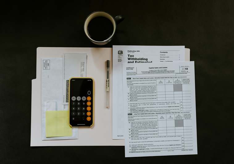 Clean line illustration showing Bitcoin and Ethereum icons flowing into a tax document with checkmark and IRS seal
